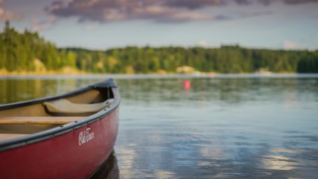 a red boat floating in the water