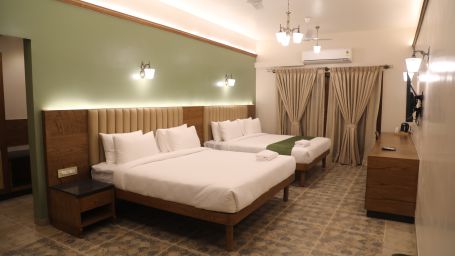 two double beds in one of the Heritage Suites at Summer House, Nandi Hills