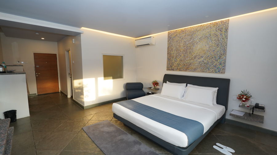 An image of a bedroom with twin beds and other room amenities - Argo By Trance, Goa