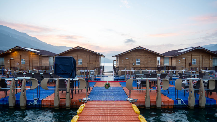 ariel and front view of the floating huts at Le ROI Floating Huts Eco Rooms captured during the day and at night9