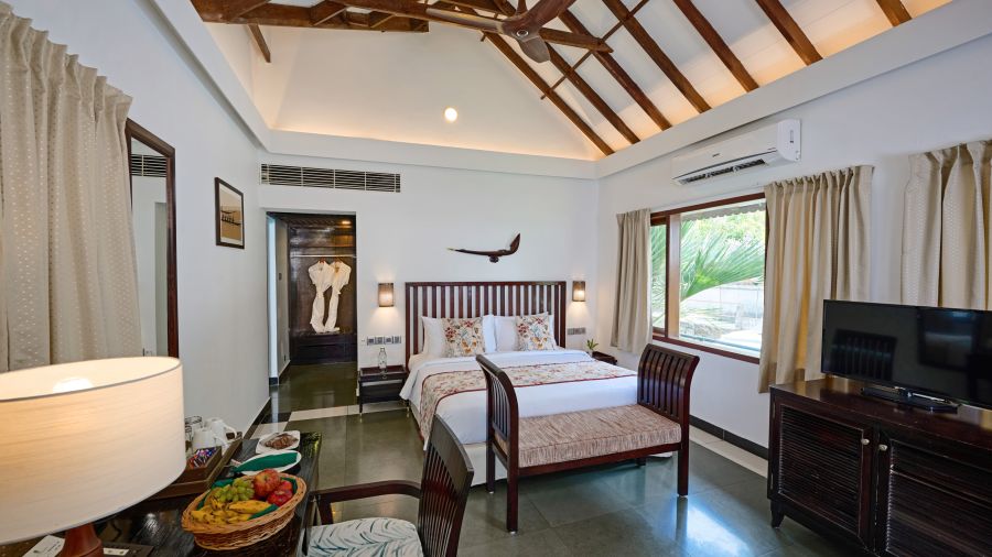 a double bed inside one of the rooms - Rhythm Kumarakom