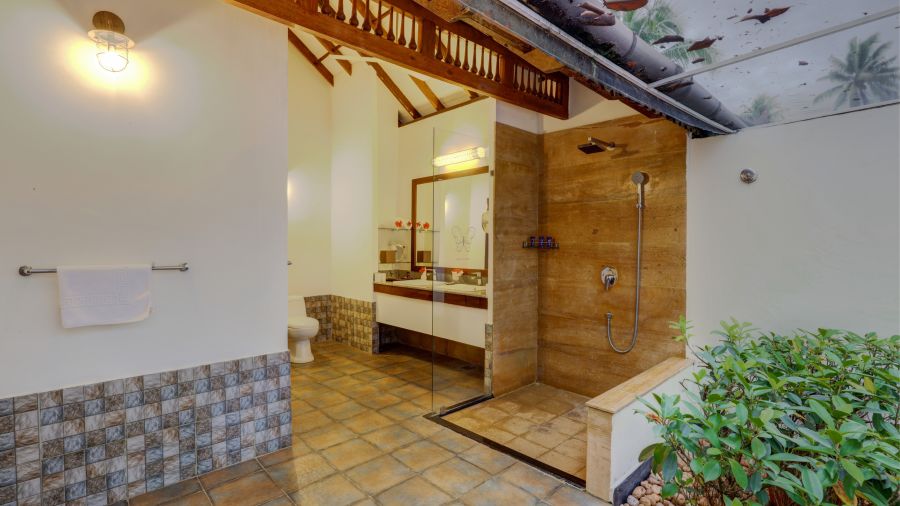 an overview of the bathroom inside one of the rooms - Rhythm Kumarakom