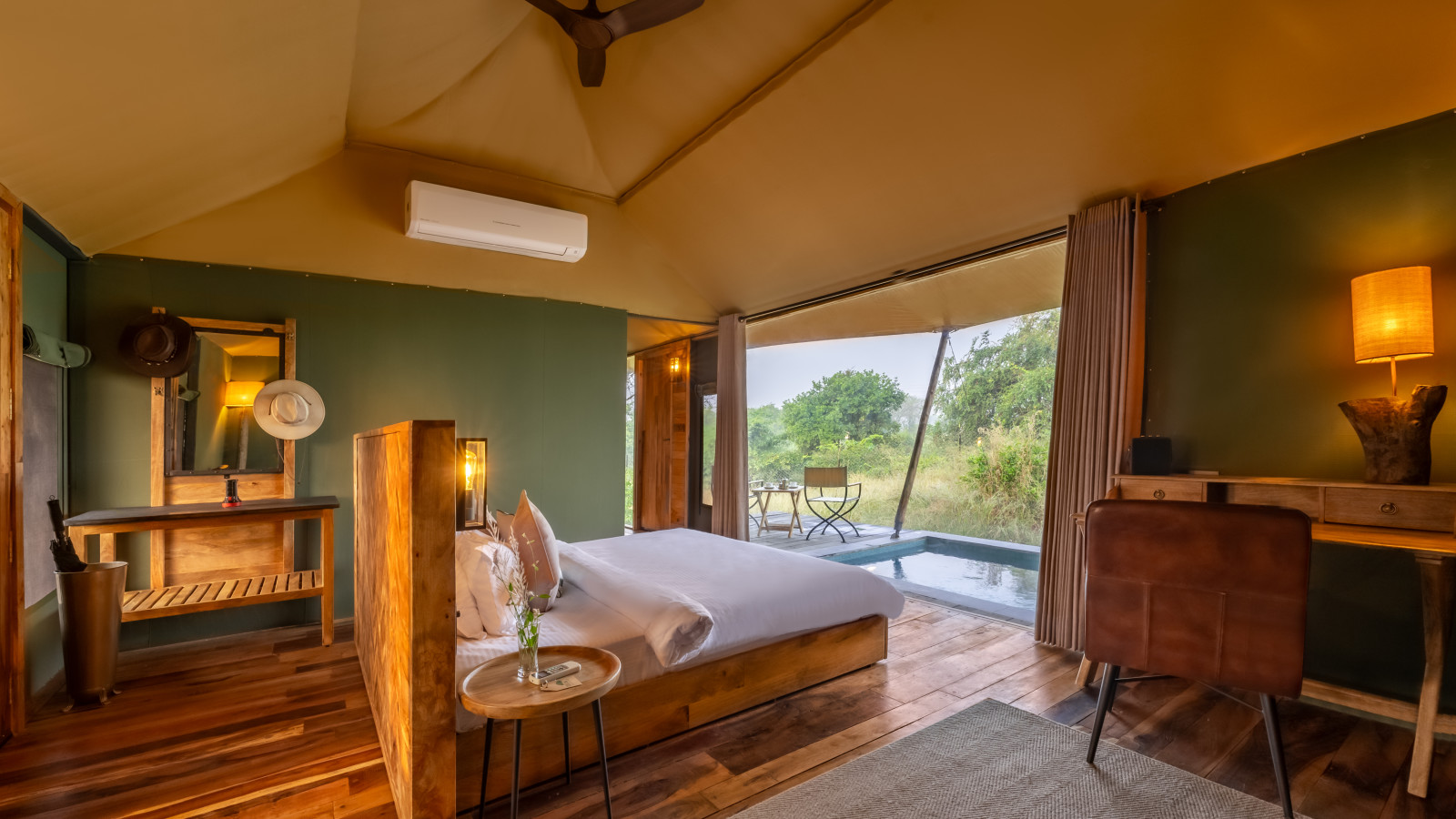 interior of a room with double bed at Trees N Tigers Tadoba