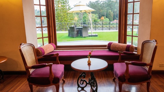 the sitting area overlooking the lawn at The Hearth, the coffee shop in Kodaikanal