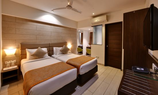 alt-text Twin beds inside the twin room at Click hotel Vadodara