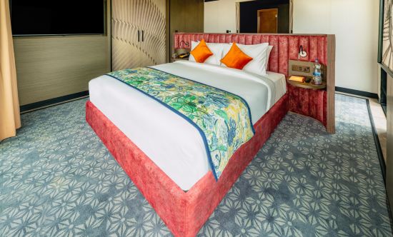 alt-text A double bed inside Contemporary Suite well equipped- parallel hotel, udaipur