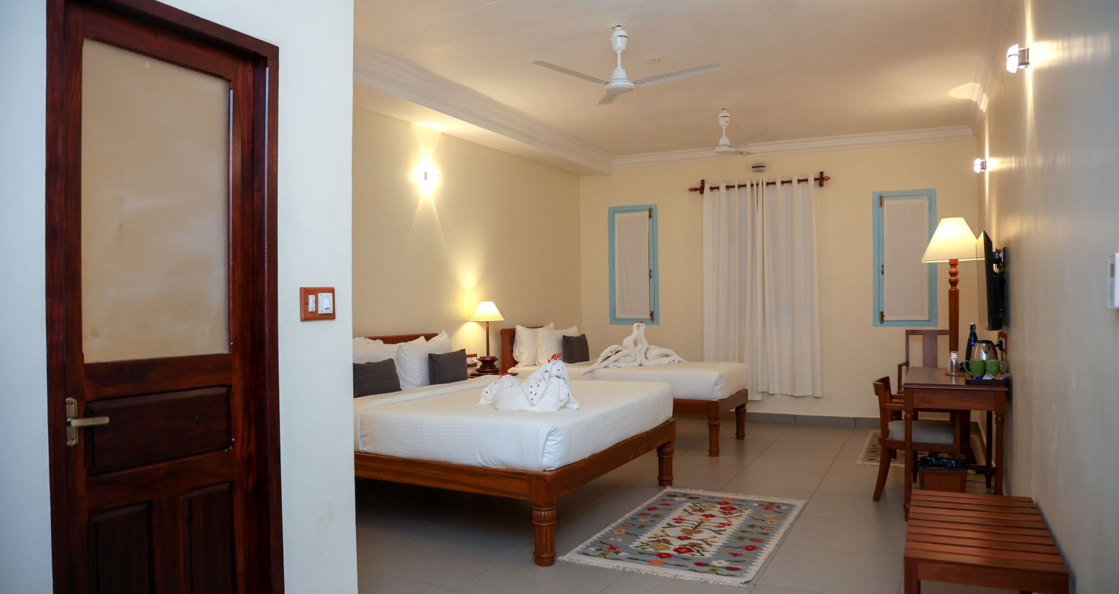 A master suite bedroom with two beds, tables and other furnitures  | Mango HIll La Serene, Ponicherry