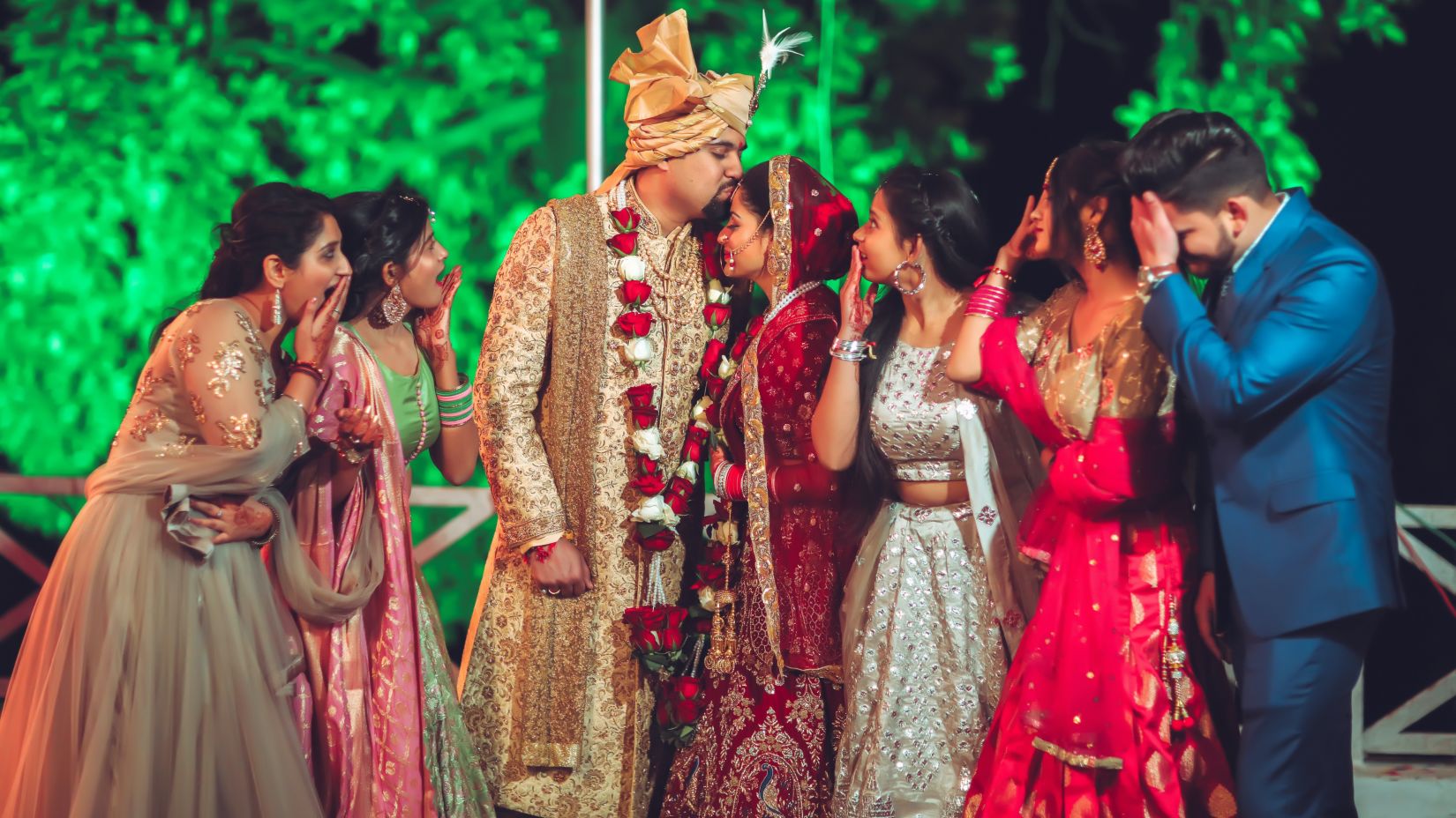 groom kissing bride's forehead 