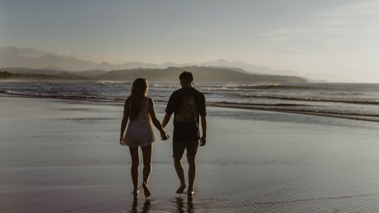 couple Walking on the beach @ Lamrin Ucassaim Hotel, Goa