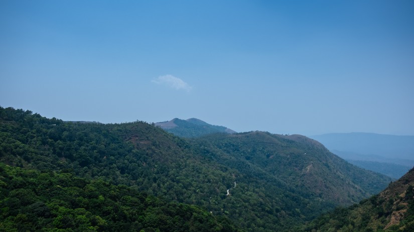 Lush green mountains observed from a nearby hill