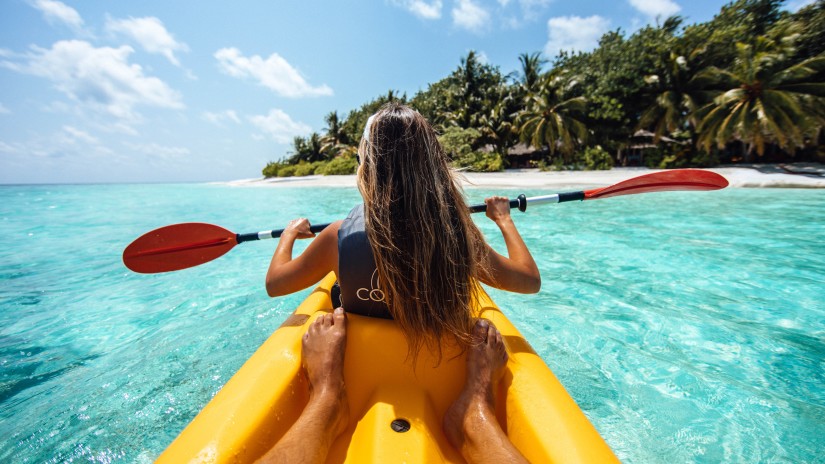 a woman kayaking in the sea 