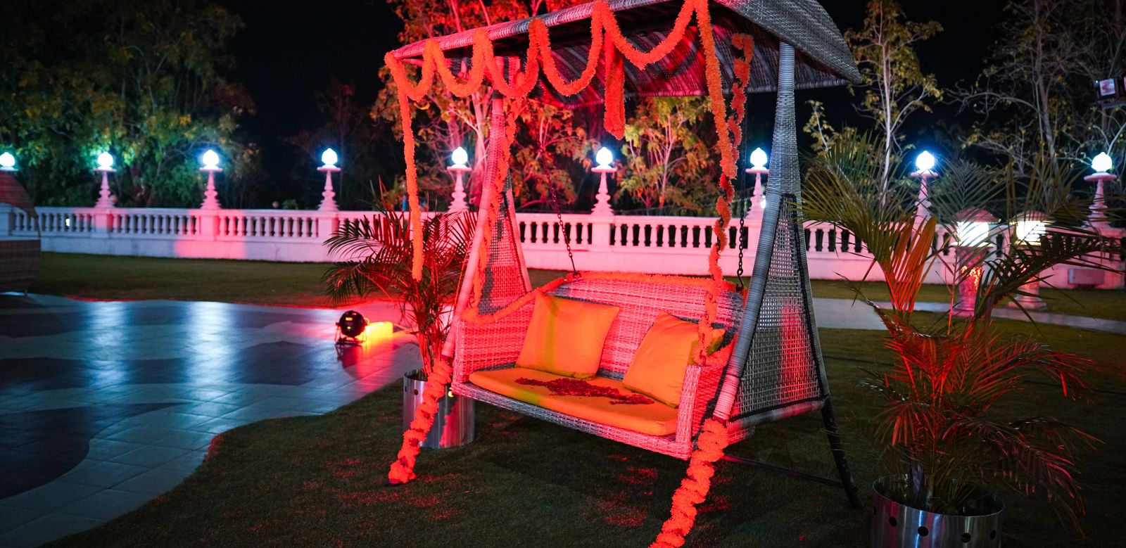 a swing on a lawn at night