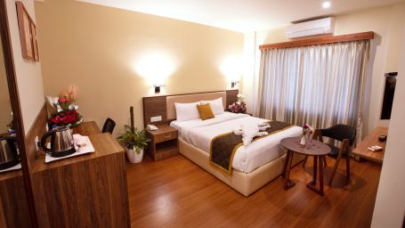 room decorated with classy decor and wooden furnishings