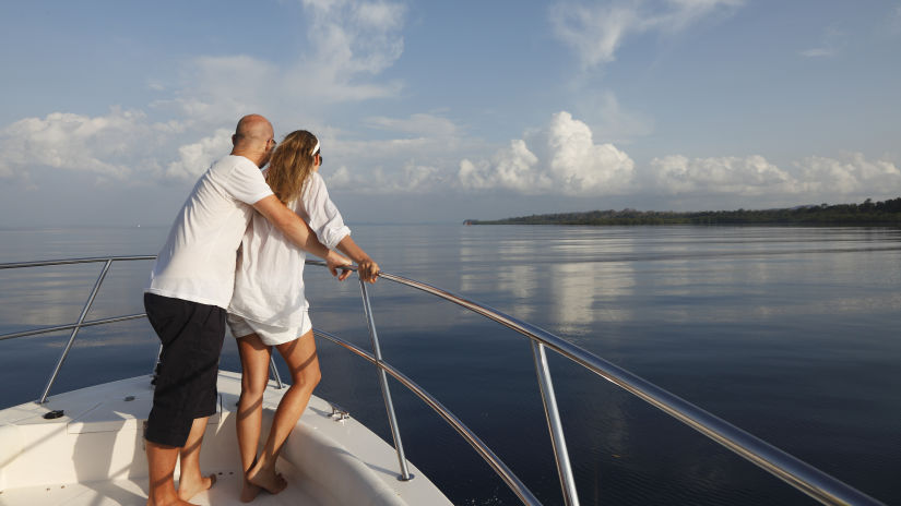 Barefoot At Havelock - image of a couple on a boat cruising on a waterbody