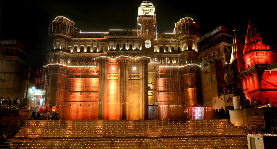 alt-text BrijRama Palace - facade of the fort decorated by well lit lights