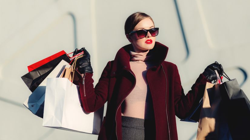 person holding shopping bags 39