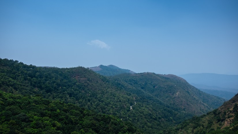 Lush green mountains observed from a nearby hill