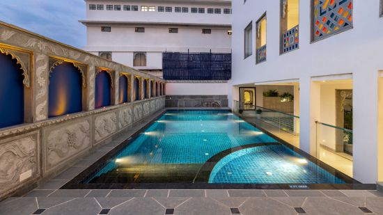 Outdoor swimming pool at Maan Vilas by Stone Wood, Udaipur