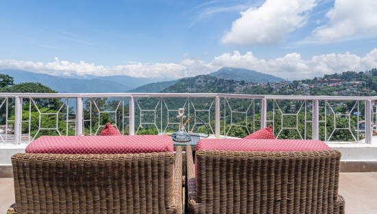 alt-text rooftop seating area at summit lillium hotel and spa