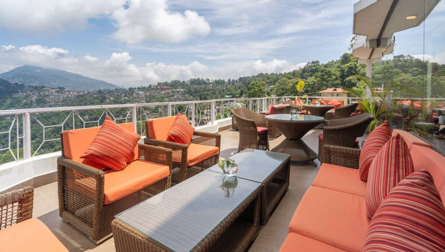 alt-text rooftop seating area at summit lillium hotel and spa