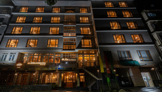 alt-text hotel exterior at night