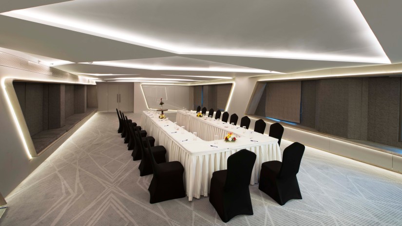 Boardroom seating inside the conference hall at Hablis Hotel, Chennai