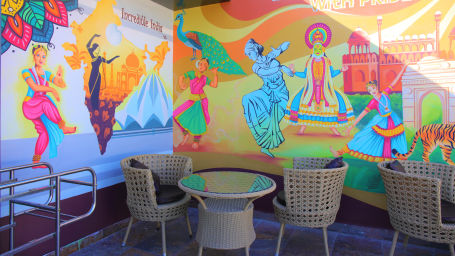 Colourful cafe with beige chairs and table