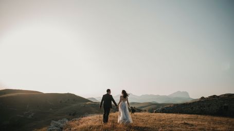 a couple posing for a wedding photoshoot outdoors