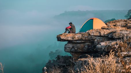 tent by a cliffside