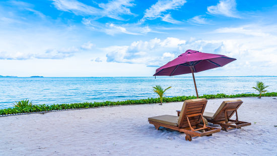 beautiful-landscape-beach-sea-ocean-with-empty-chair-deck-umbrella-nearly-coconut-palm-tree-with-white-cloud-blue-sky