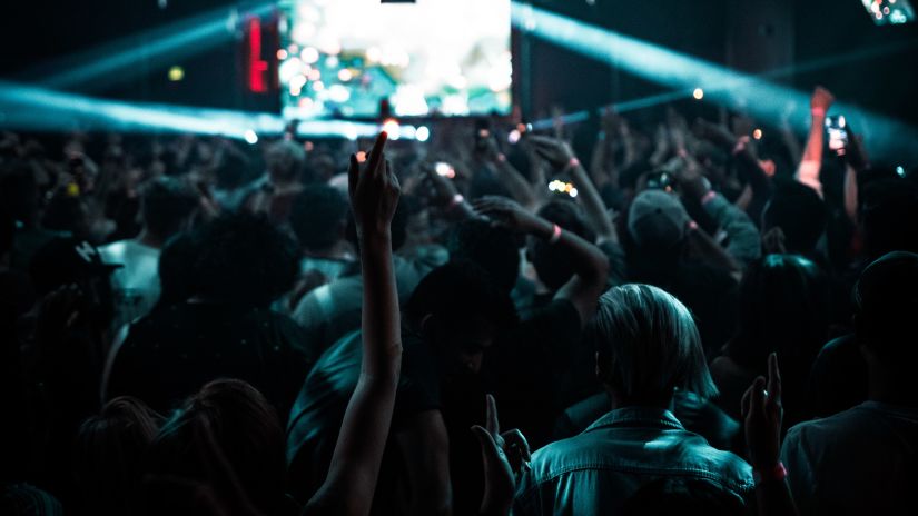 a group of people dancing in a concert