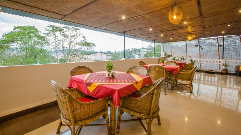 Seating arrangements at Andaman Kitchen with views of the nature - Hotel Shompen