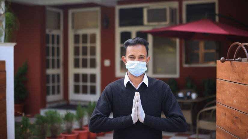 A butler greeting the viewer - Lamrin Boutique Cottages Rishikesh