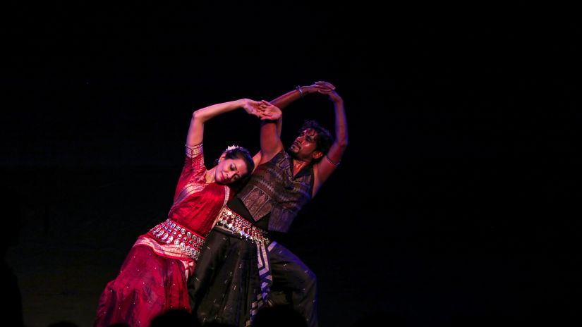 Two girls are performing the traditional dance.