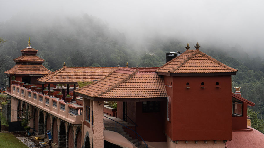 A beautiful facade of the resort with mist around  | Mango Hill, Yercaud