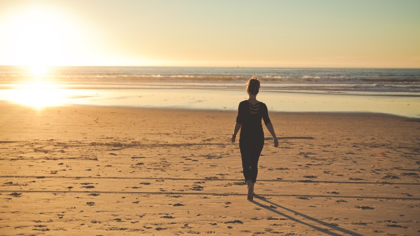 person walking on Juhu Beach