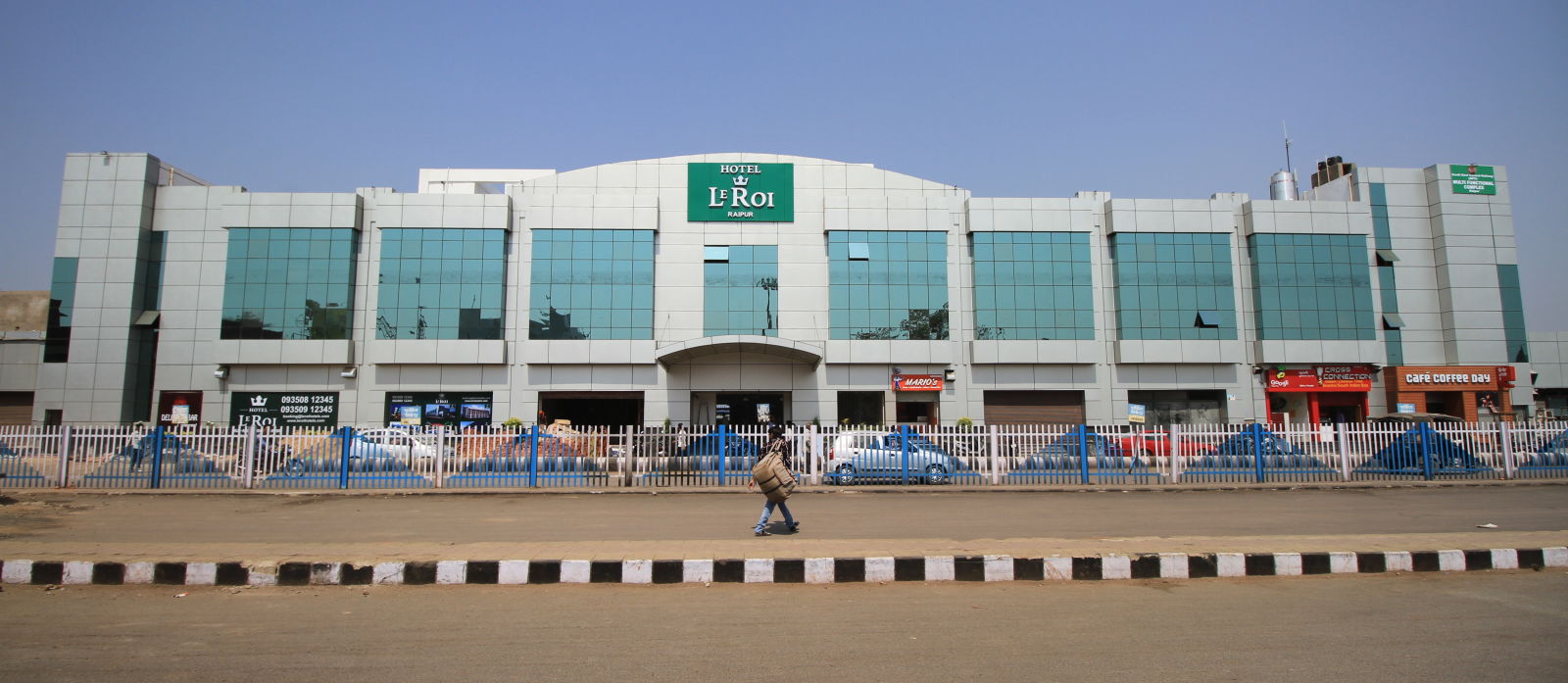 exterior view of hotel during the day - le roi raipur hotel