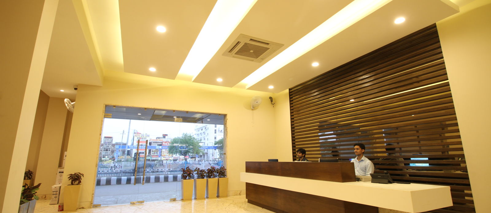 reception area of the hotel that cpatures the view of the railway station from the hotel premises - le roi raipur hotel2