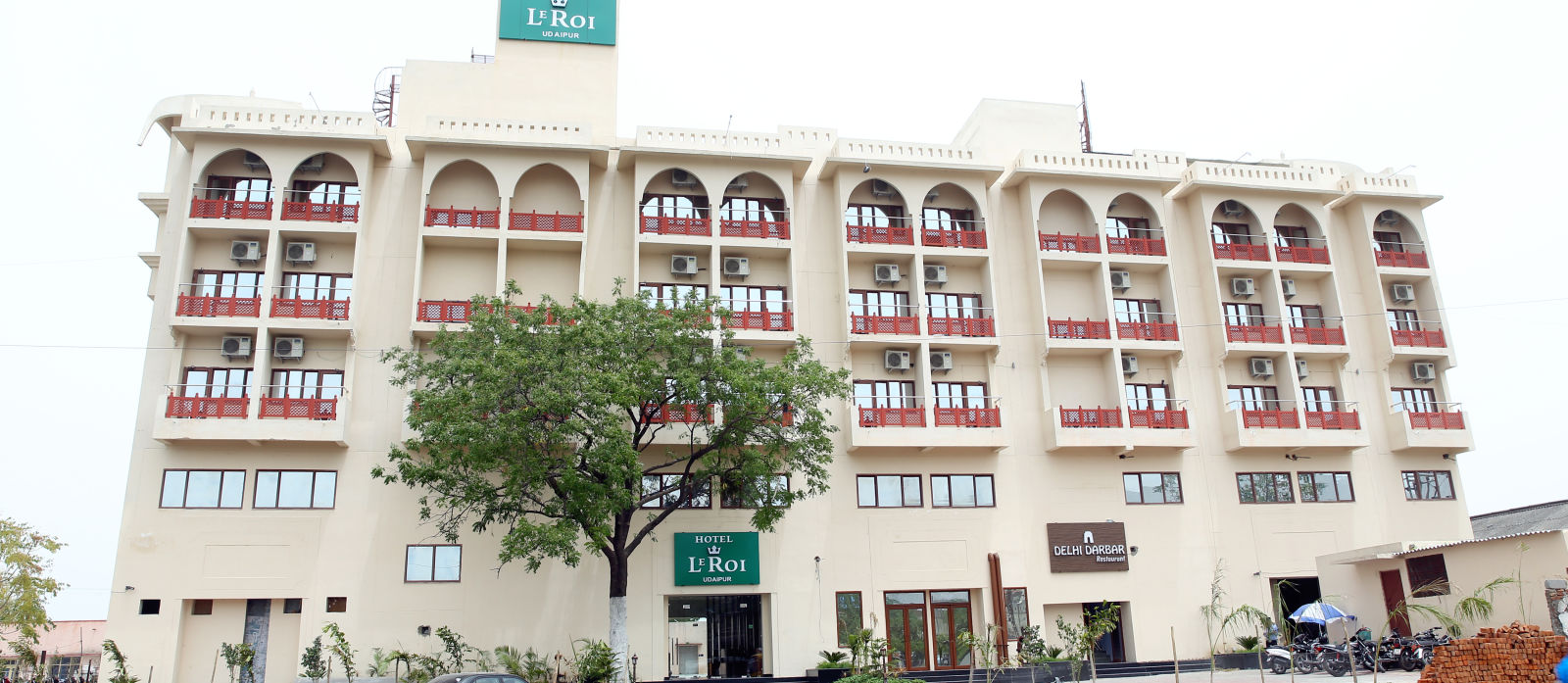 exterior view of hotel building shot from a lower angle captured during the day - le roi udaipur hotel2