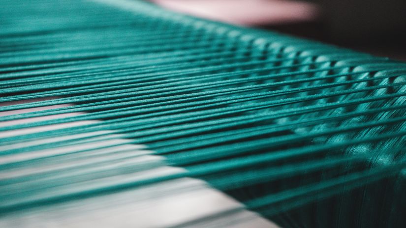 a close up shot of how a kanjiram saree is made from handlooms