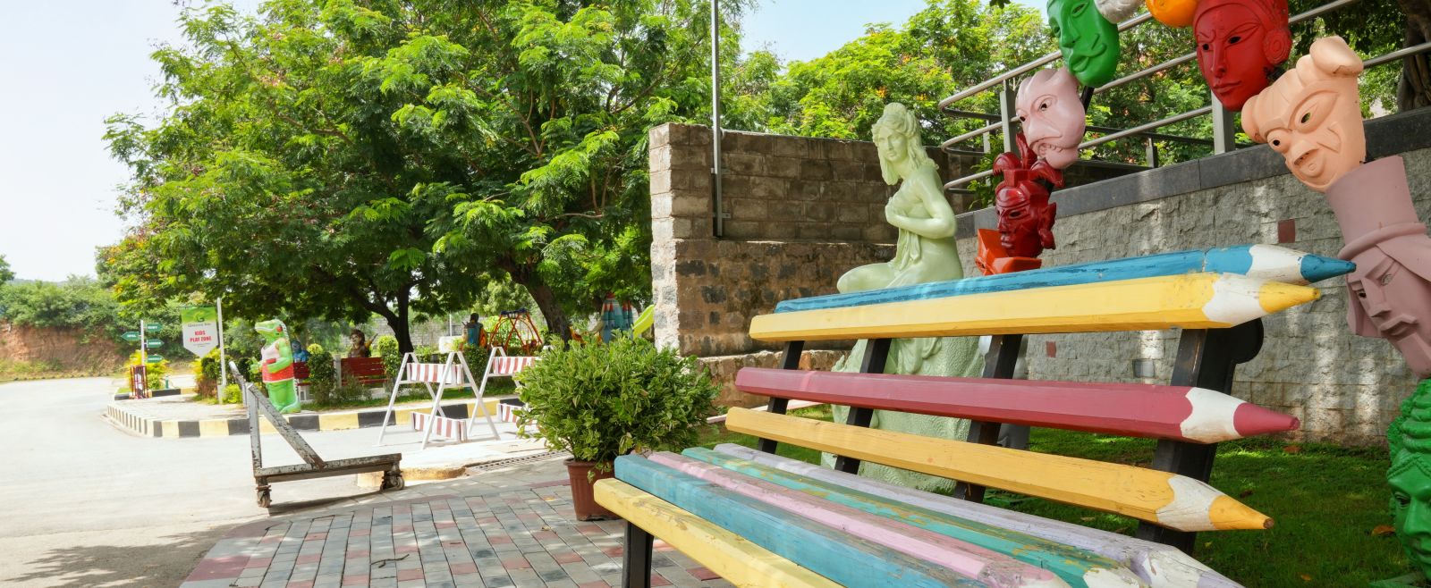 a pencil shaped seats surrounded by trees at Greens Inn