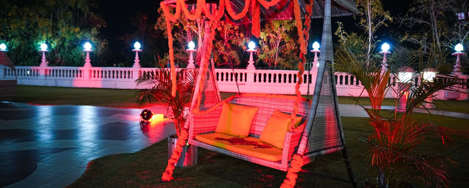 a swing on a lawn at night jbhp3h