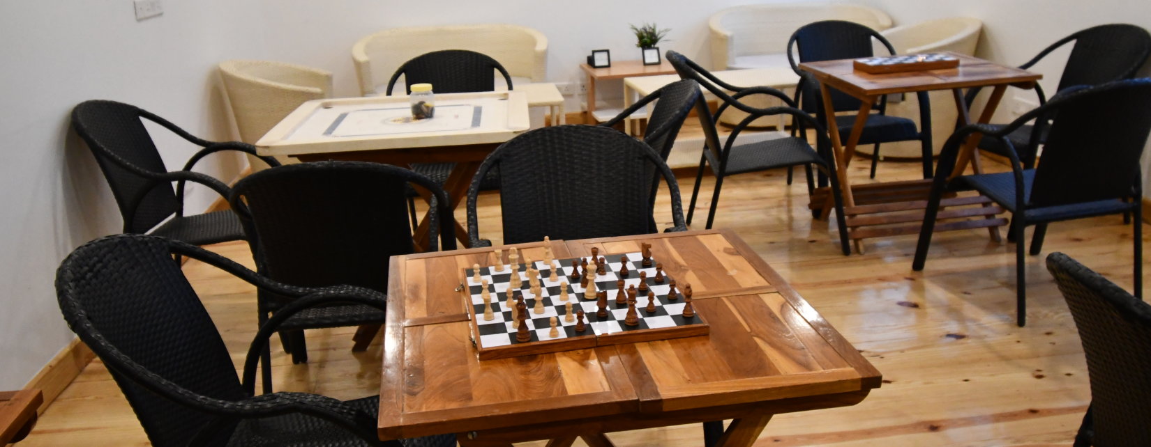 a table with a chess board in the recreational room at The Tattva Boutique Resort, Joshimath