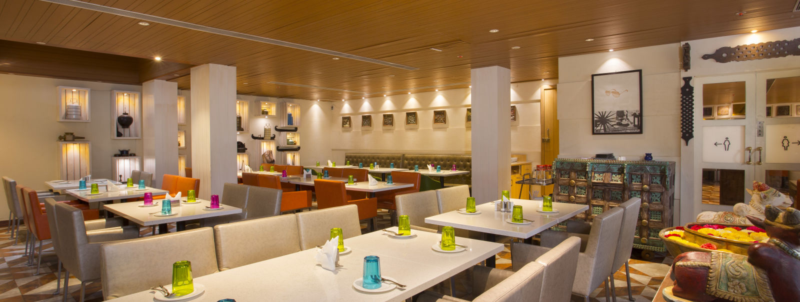 view of a restaurant with rows of rectangular tables with chairs on the long sides - Hotel Fountain Tree By TGI - JP Nagar, Bangalore