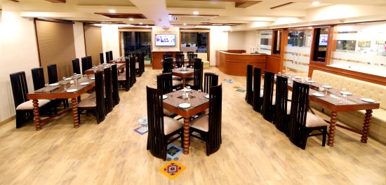 alt-text The seating arrangement at the Restaurant 2 - Udman Haridwar by Ferns N Petals