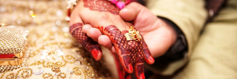 bride and groom holding hands