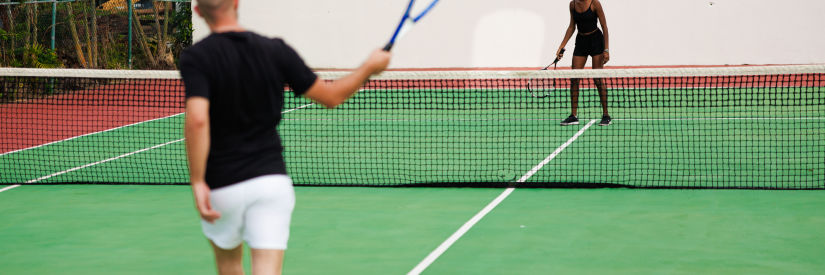 people playing tennis at the court - The Soco House