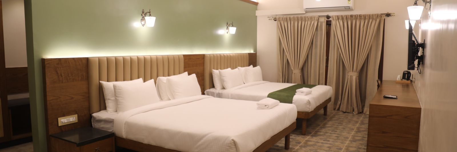 two double beds in one of the Heritage Suites at Summer House, Nandi Hills