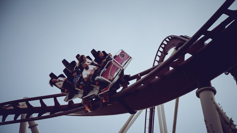 Riding a roller coaster that curves dramatically against the sky gives thrill-seekers a jolt. - Fort JadhavGADH