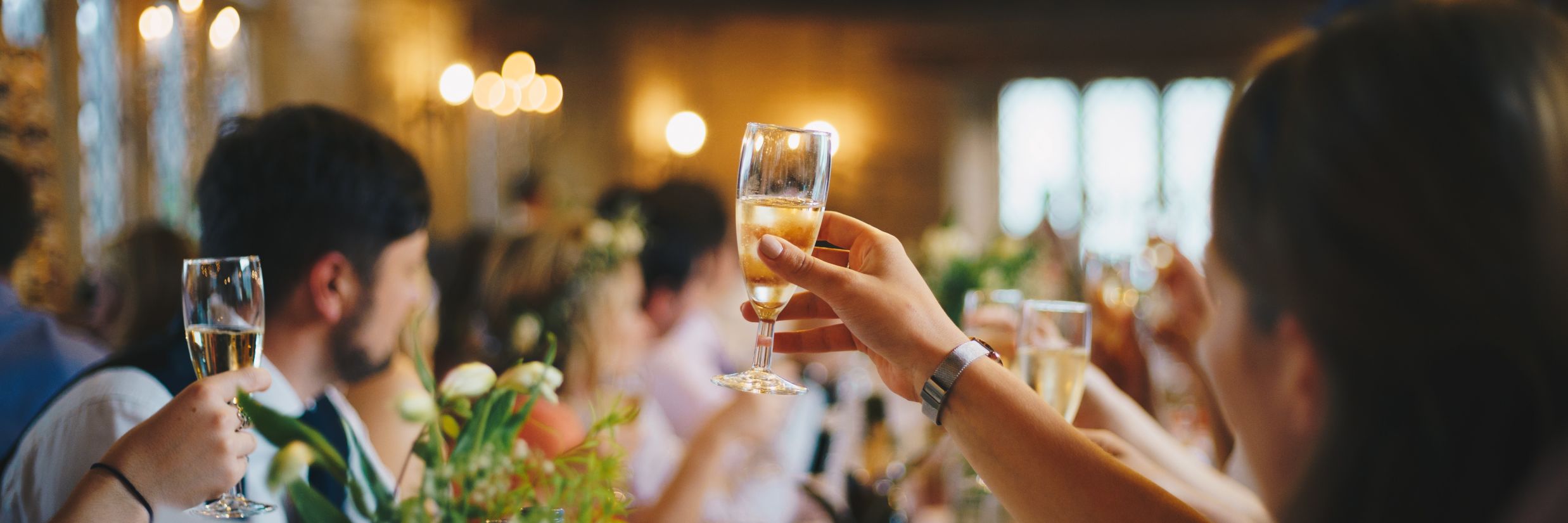 Rosetum - People raising their glasses to a toast on a wedding